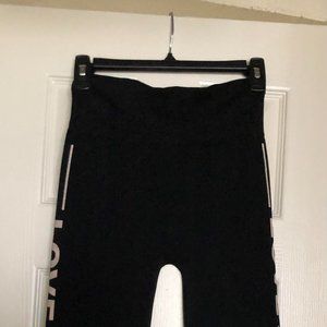 FEATHERS size S/M women's black and pink biker shorts